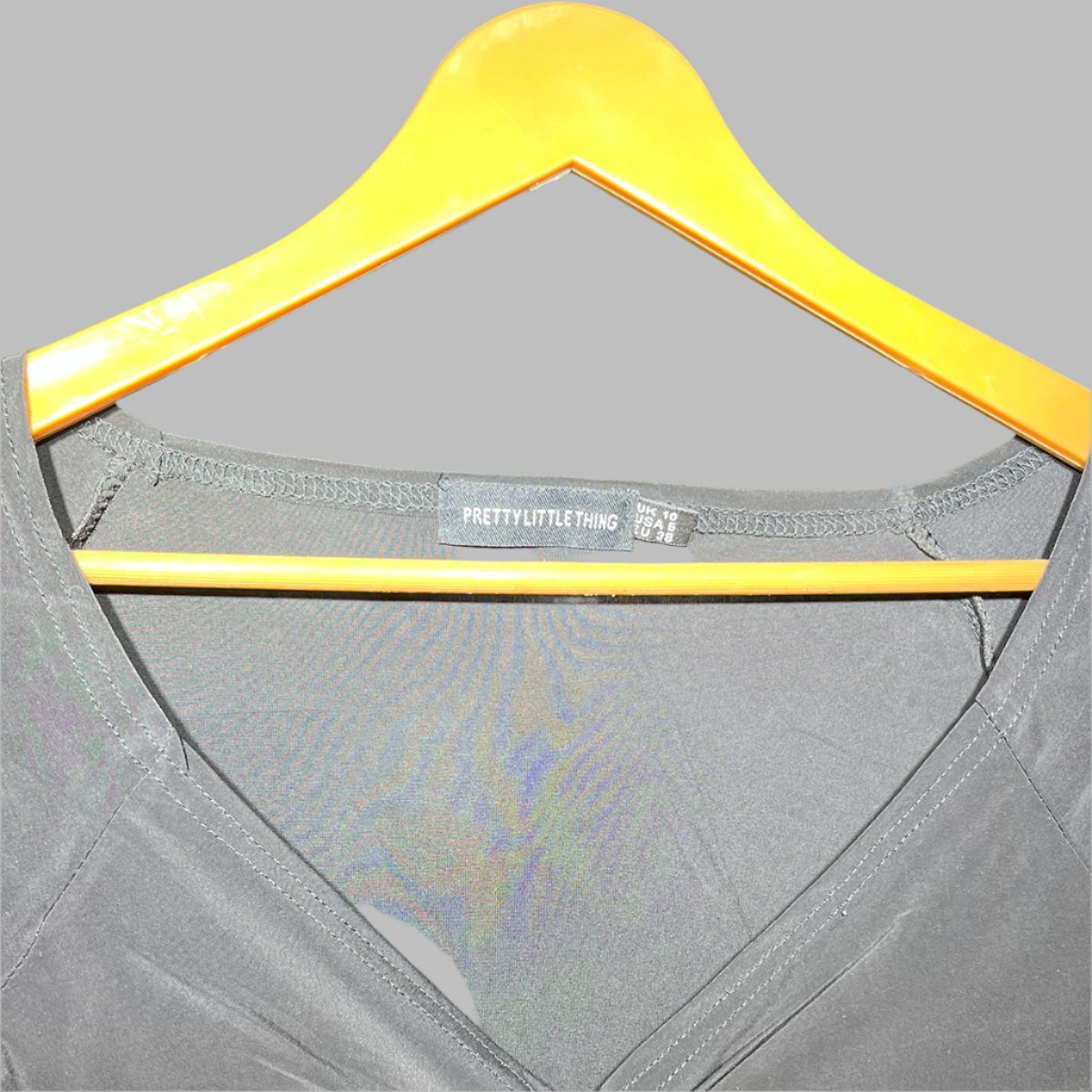 PrettyLittleThing Black Ruched Long Sleeve Cropped Top β Chic & Trendy #143